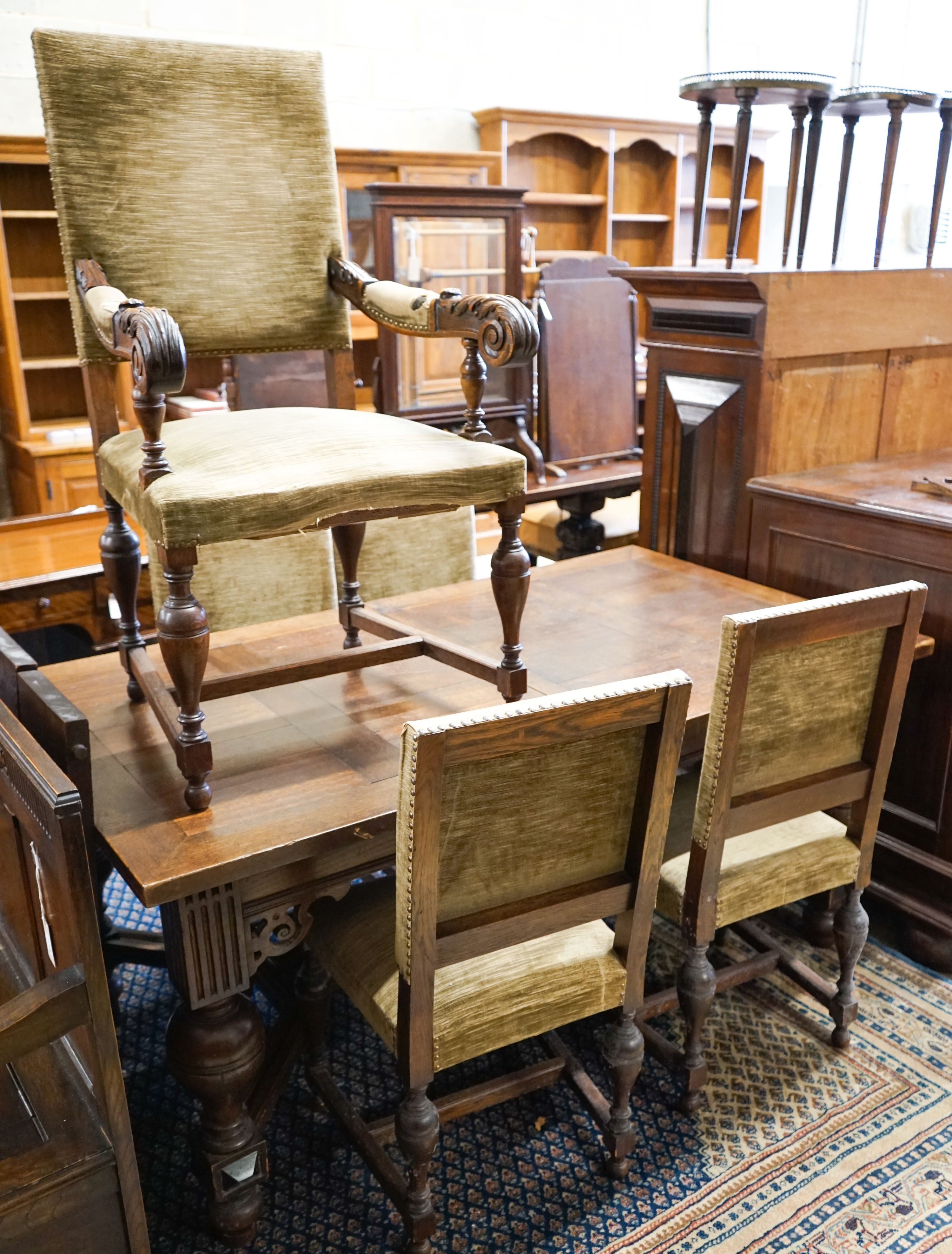 A 19th century Dutch rectangular oak extending dining table, 220cm extended, width 94cm, height 76cm on four carved bulbous supports (two additional leaves) and a set of five dining chairs